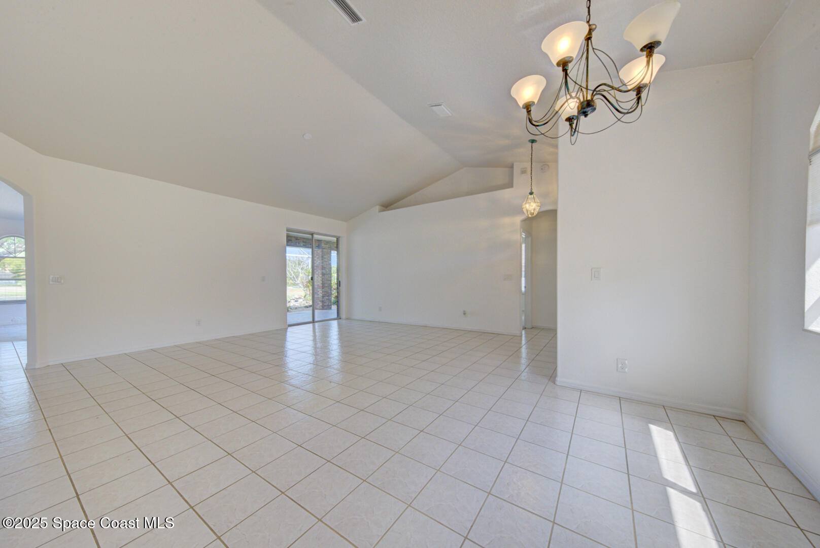 4065 Sand Ridge Drive Merritt Island, FL 32953 - Photo 8 of 59 dining room with chandelier