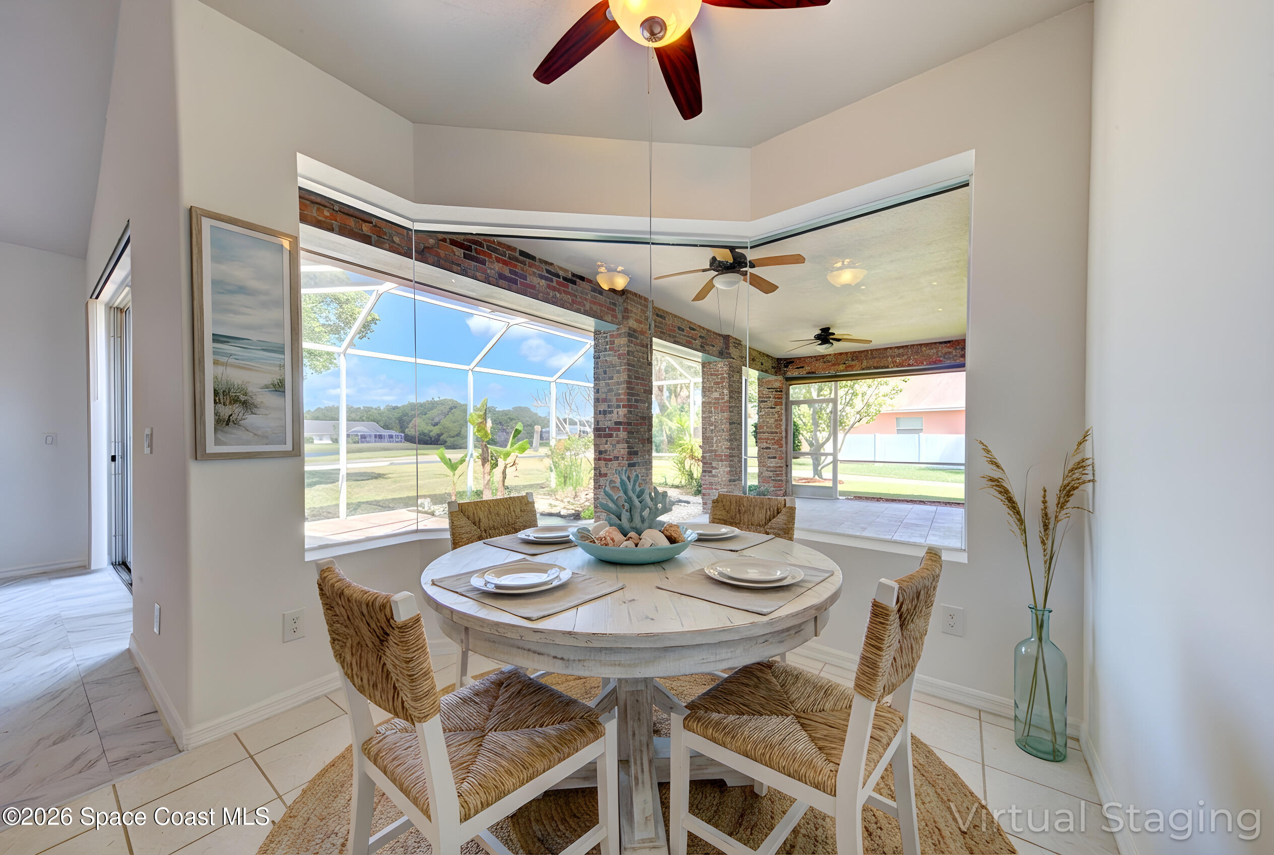 4065 Sand Ridge Drive Merritt Island, FL 32953 - Photo 10 of 59 a view of a dining room with furniture window and outside view
