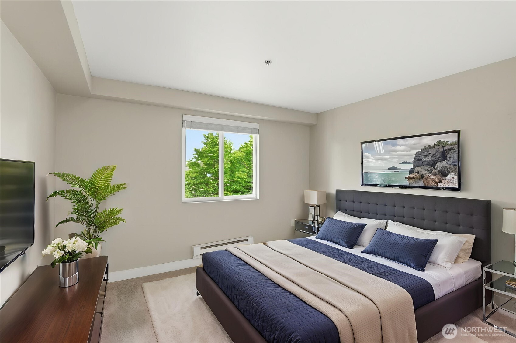 16409 Currie Road Southeast, Unit A308 Monroe, WA 98272 - Photo 18 of 21 a bedroom with bed and a potted plant