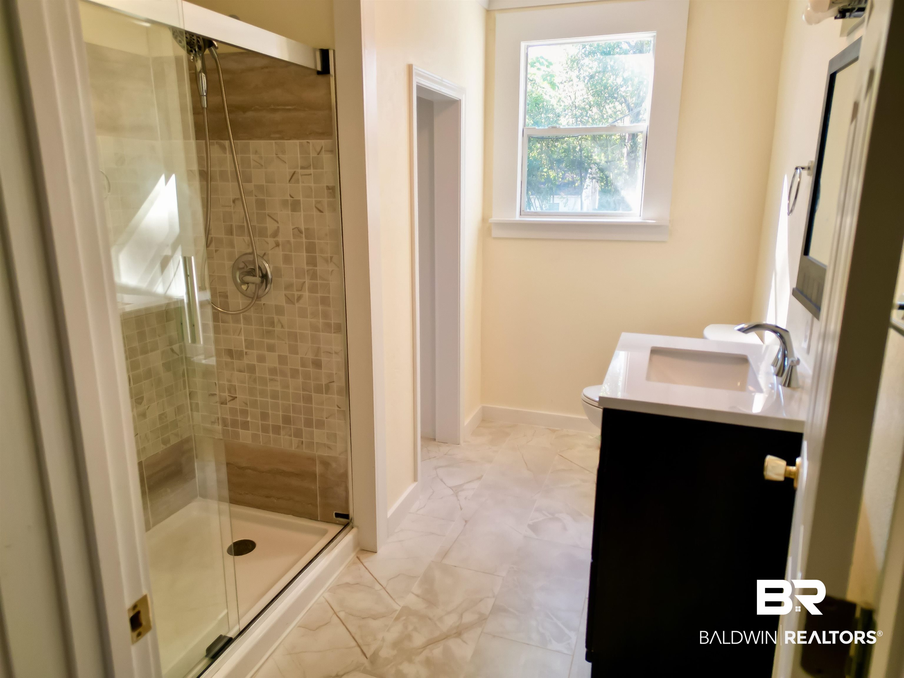 73 Liberty Street Monroeville, AL 36460 - Photo 14 of 29 Bathroom featuring vanity, walk in shower, and toilet