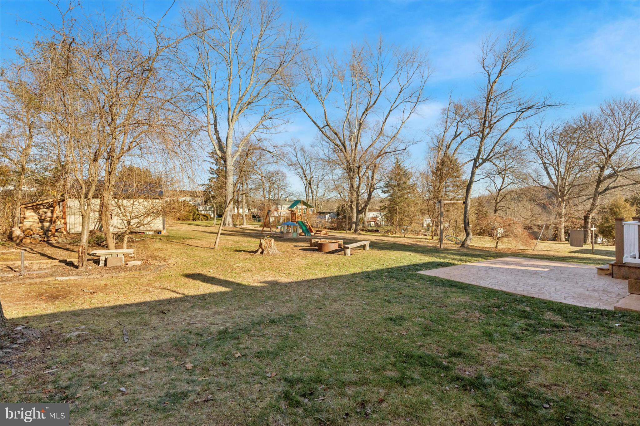 673 Barrington Road Collegeville, PA 19426 - Photo 24 of 28 Large flat backyard with play area and trees!
