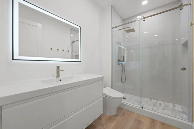 a bedroom with a bed and a potted plant