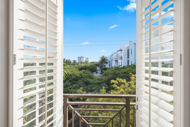 a view of an empty room and closet area