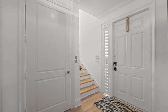 a view of a hallway with stairs