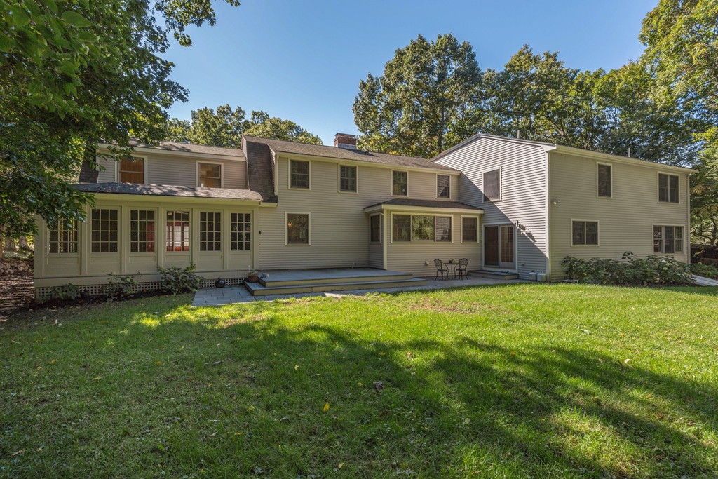 34 Leslie Road Winchester, MA 01890 - Photo 26 of 26 a front view of a house with a garden