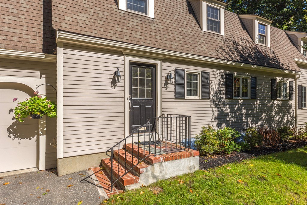 34 Leslie Road Winchester, MA 01890 - Photo 3 of 26 a front view of a house with garden