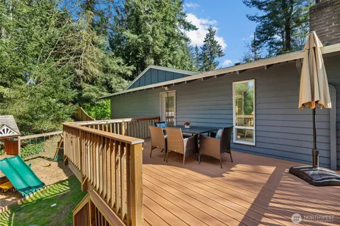 a view of roof deck with furniture
