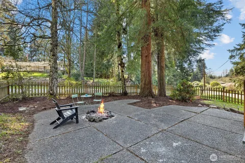 a view of a bench in a backyard