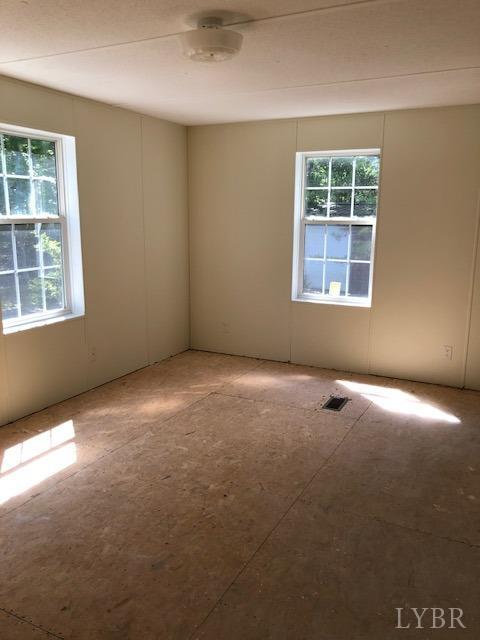 341 Broad Ridge Road Sandy Level, VA 24161 - Photo 13 of 16 an empty room with windows