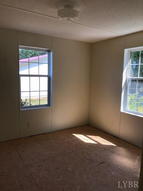 341 Broad Ridge Road Sandy Level, VA 24161 - Photo 15 of 16 an empty room with windows