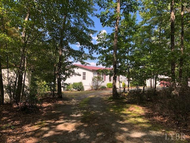 341 Broad Ridge Road Sandy Level, VA 24161 - Photo 2 of 16 a view of a yard with a tree
