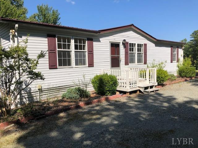 341 Broad Ridge Road Sandy Level, VA 24161 - Photo 5 of 16 a front view of a house with a yard