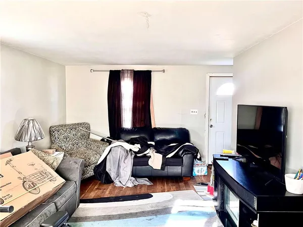a kitchen with a sink a refrigerator a stove and cabinets