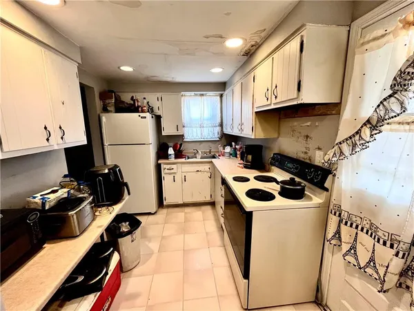 a view of a workspace with furniture and wooden floor