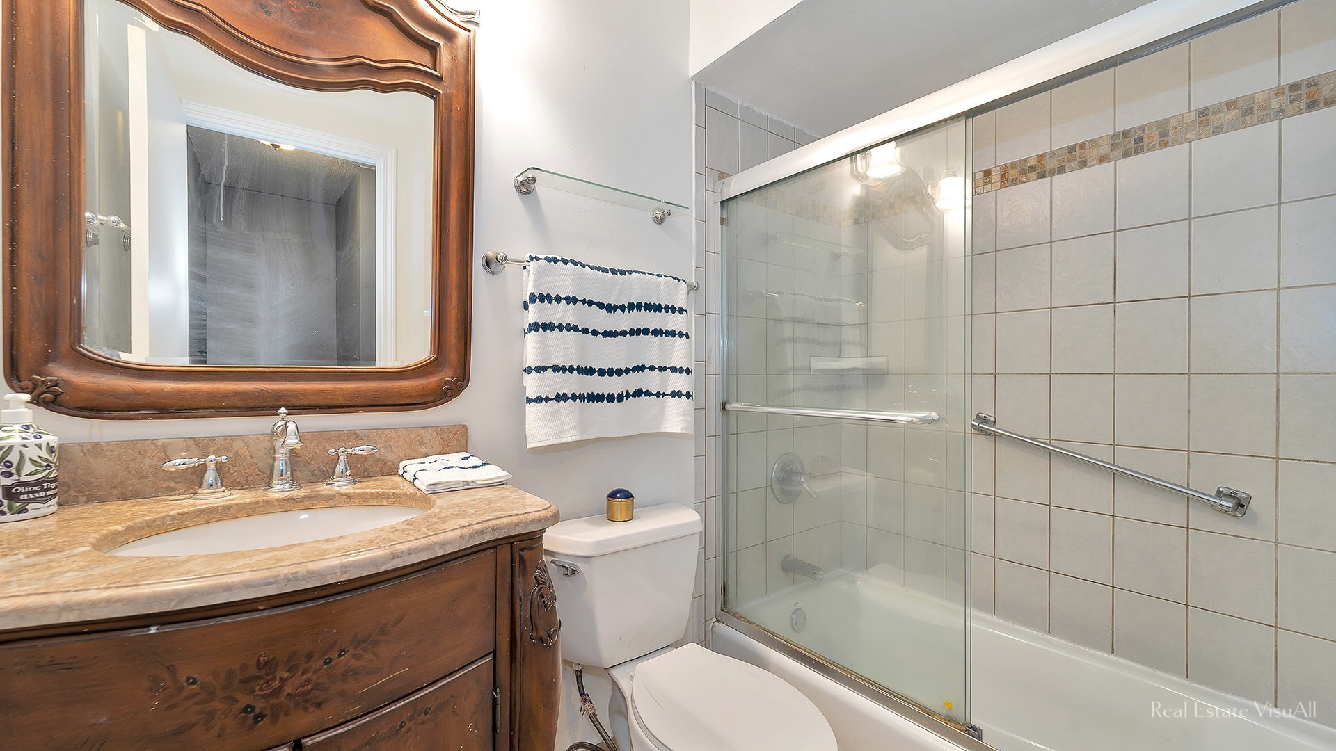 1452 Inverrary Lane Deerfield, IL 60015 - Photo 12 of 16 a bathroom with a granite countertop sink toilet a mirror and shower