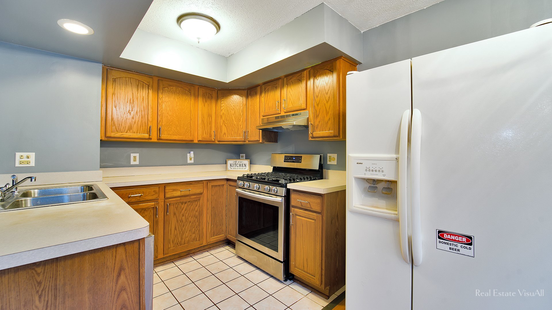 1452 Inverrary Lane Deerfield, IL 60015 - Photo 5 of 16 a kitchen with stainless steel appliances granite countertop a sink stove and refrigerator