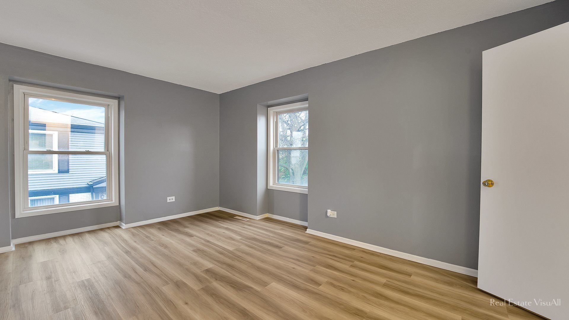 1452 Inverrary Lane Deerfield, IL 60015 - Photo 8 of 16 a view of an empty room with window and wooden floor