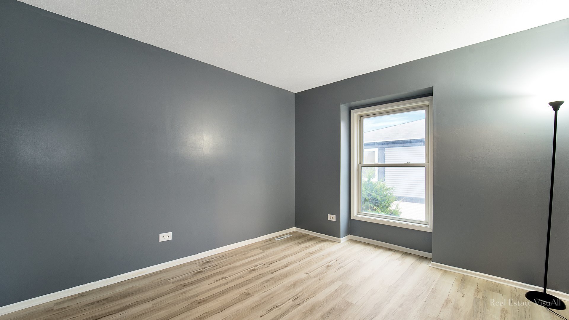 1452 Inverrary Lane Deerfield, IL 60015 - Photo 10 of 16 an empty room with wooden floor and windows