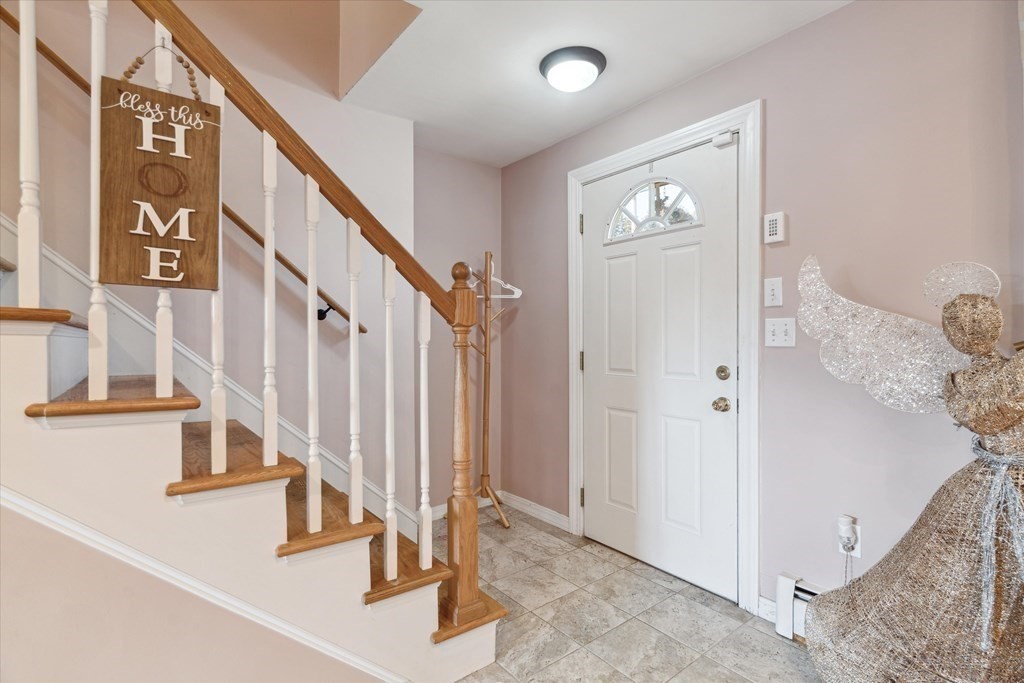 49 Dibble Road Lynn, MA 01904 - Photo 18 of 41 a view of staircase with white walls and lots of frames on wall
