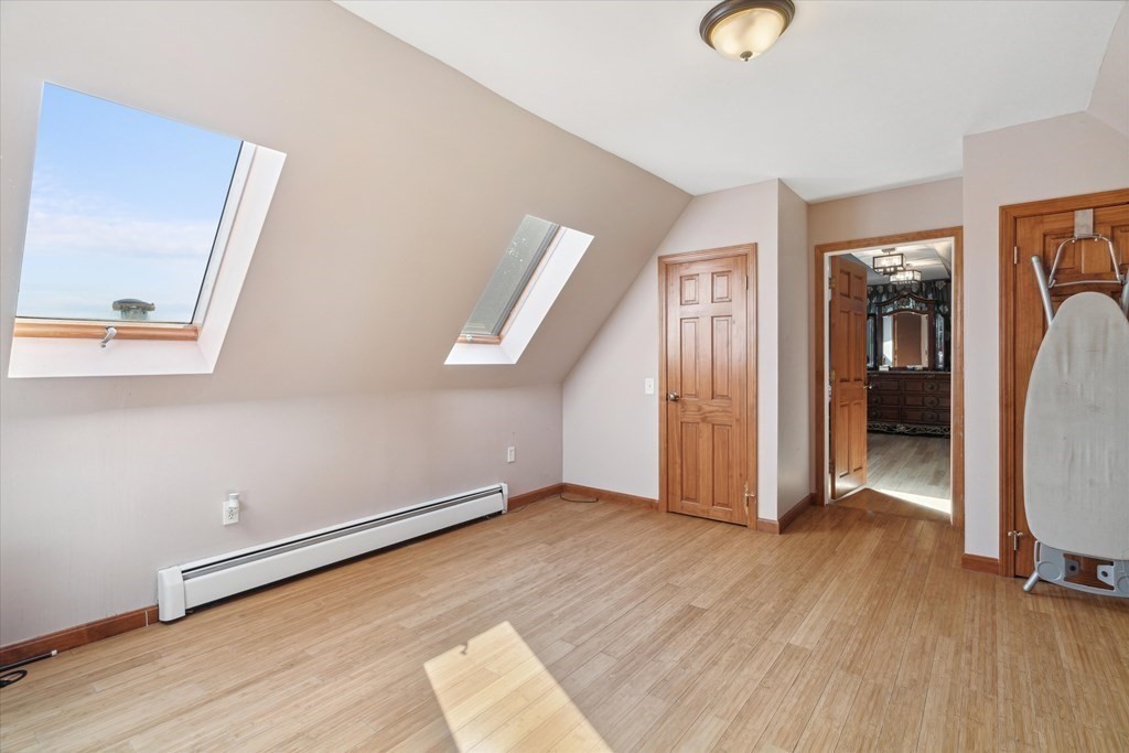 49 Dibble Road Lynn, MA 01904 - Photo 21 of 41 a view of an empty room with wooden floor and a window