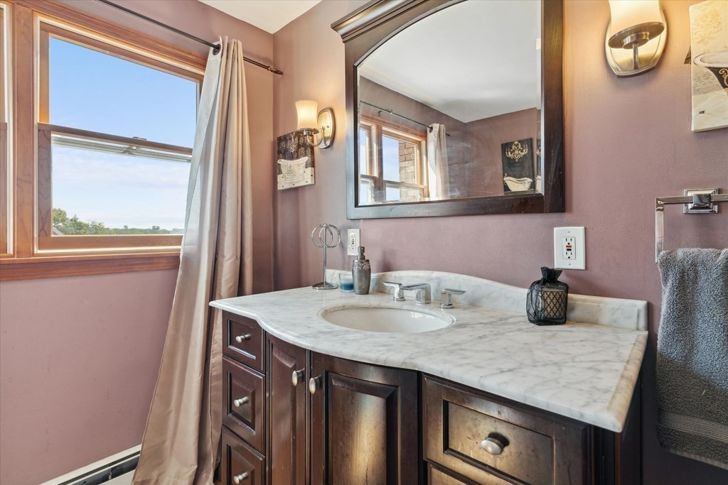 49 Dibble Road Lynn, MA 01904 - Photo 23 of 41 a bathroom with a granite countertop sink a vanity and mirror