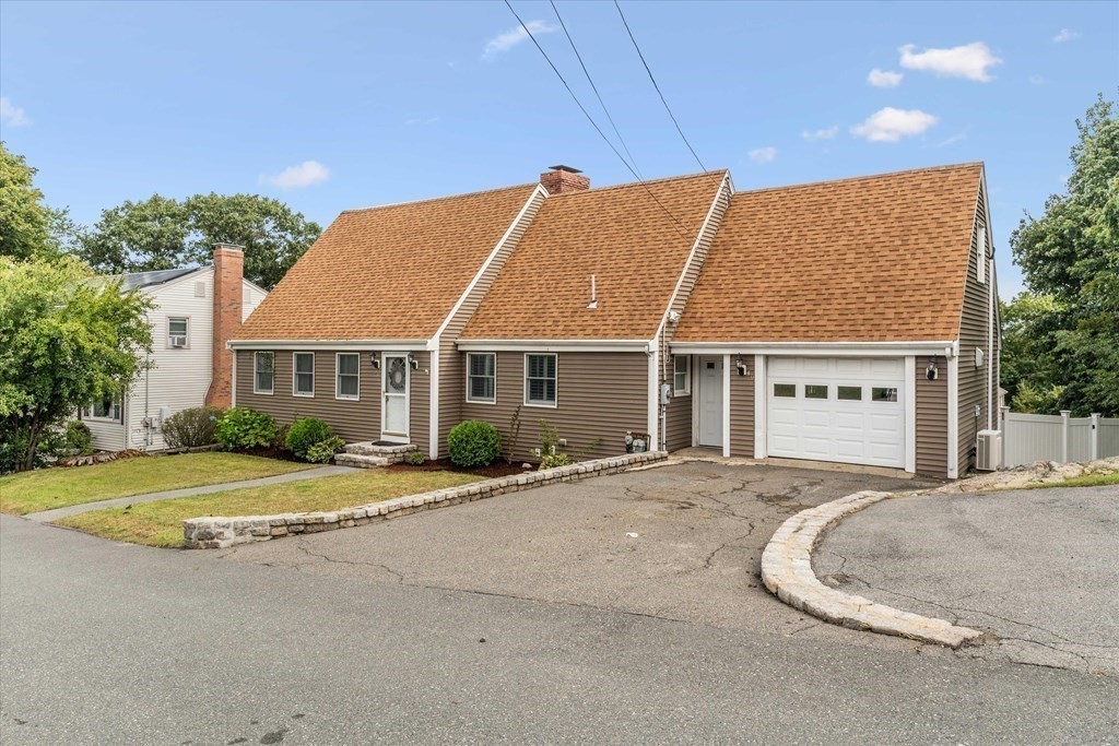 49 Dibble Road Lynn, MA 01904 - Photo 27 of 41 a front view of a house with a garden and porch
