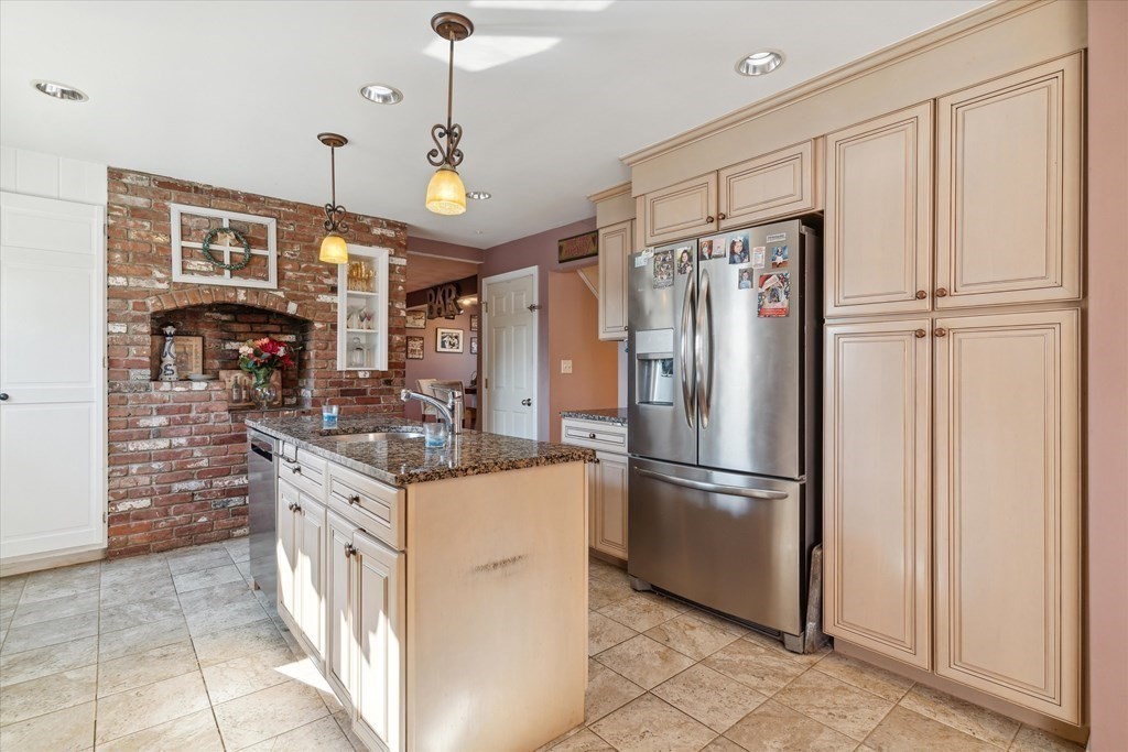49 Dibble Road Lynn, MA 01904 - Photo 7 of 41 a kitchen with stainless steel appliances granite countertop a stove a refrigerator and a refrigerator