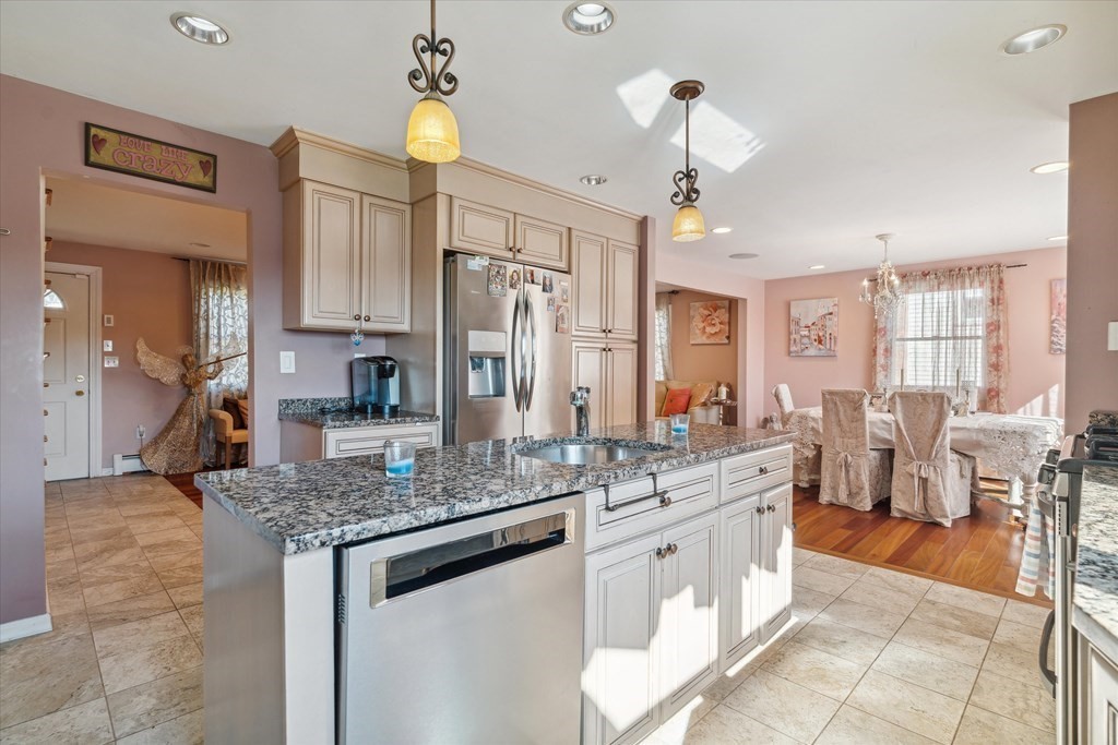 49 Dibble Road Lynn, MA 01904 - Photo 8 of 41 a large kitchen with a counter space a sink appliances and cabinets