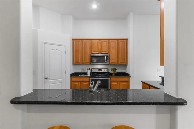 a dining room with furniture and a chandelier