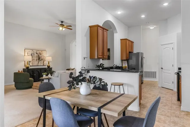 a kitchen with stainless steel appliances granite countertop a sink a stove and a refrigerator