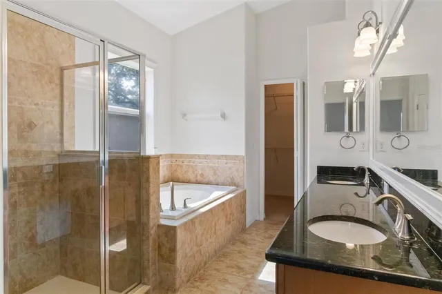 a bathroom with a glass shower door