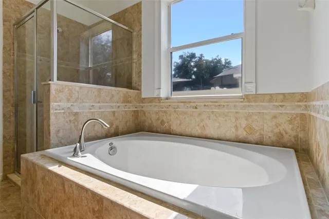 a view of a hallway with bathroom