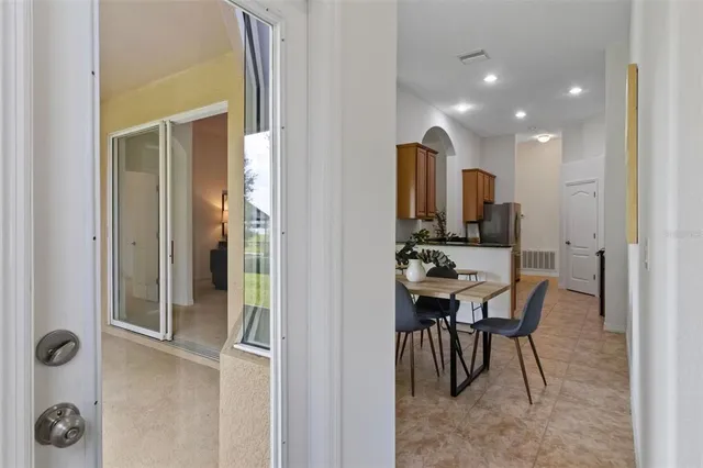 a view of a house with a yard balcony and sitting area