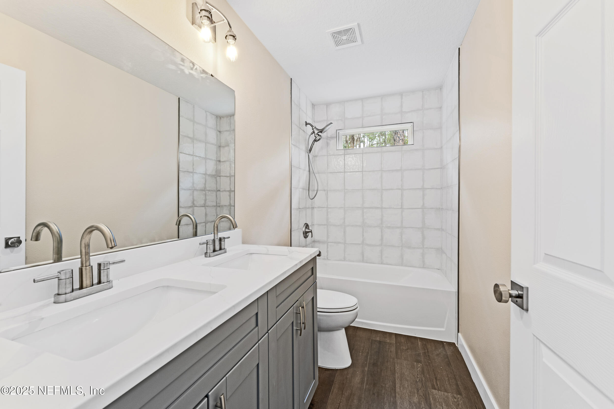 105 Southeast 3rd Street Georgetown, FL 32139 - Photo 24 of 29 a bathroom with a bathtub shower sink mirror and toilet