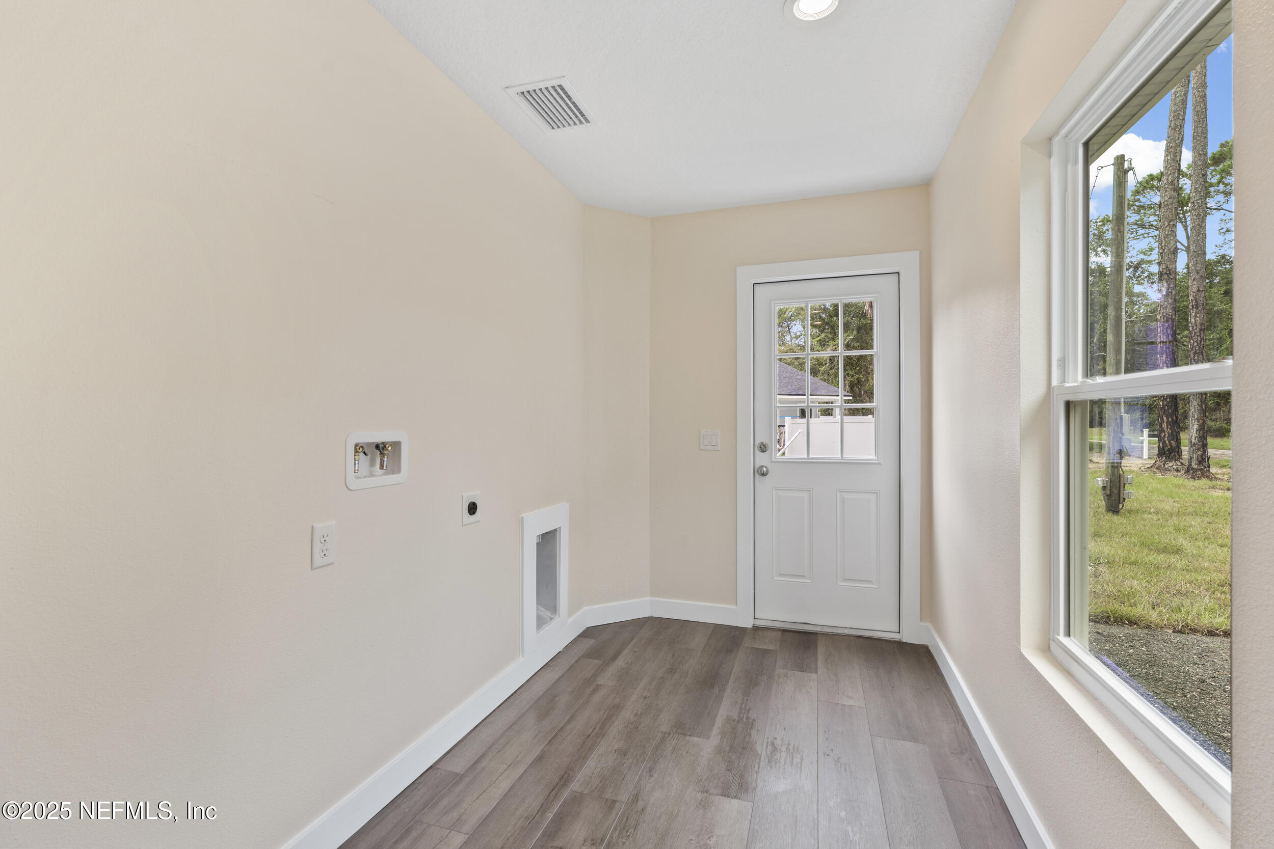 105 Southeast 3rd Street Georgetown, FL 32139 - Photo 27 of 29 a view of hallway with window and wooden floor