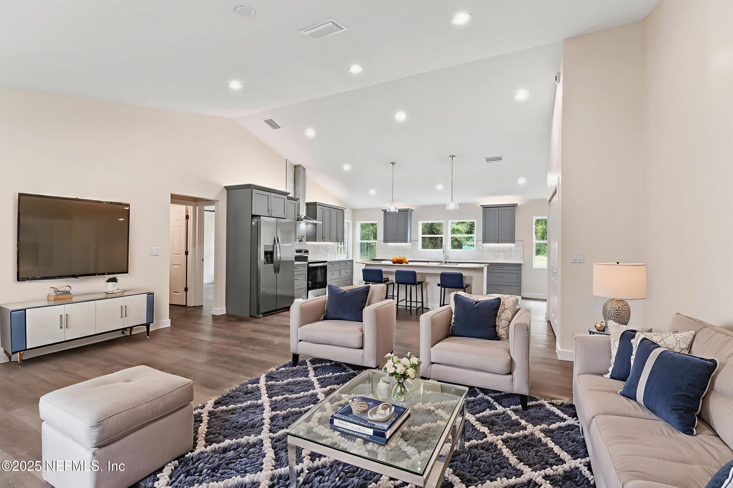 105 Southeast 3rd Street Georgetown, FL 32139 - Photo 7 of 29 a living room with furniture and a flat screen tv