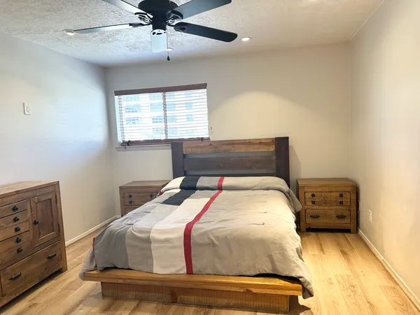 a bedroom with a bed and a tv