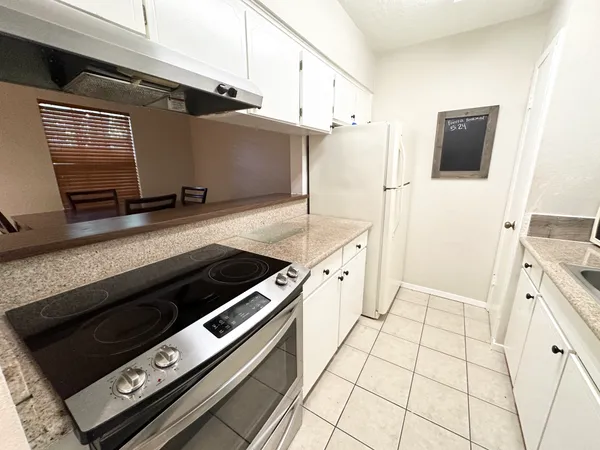 a kitchen with a stove and a microwave