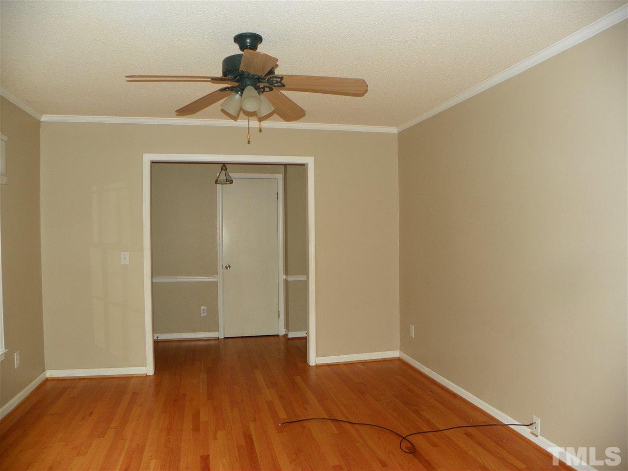5115 McCormick Road Durham, NC 27713 - Photo 4 of 11 a view of empty room with wooden floor
