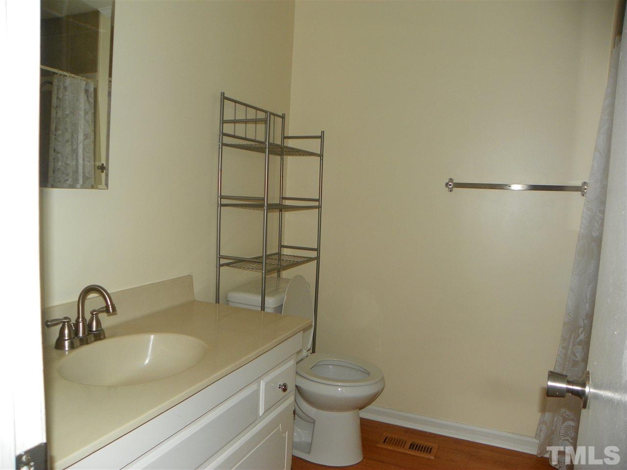 5115 McCormick Road Durham, NC 27713 - Photo 6 of 11 a bathroom with a sink and a toilet