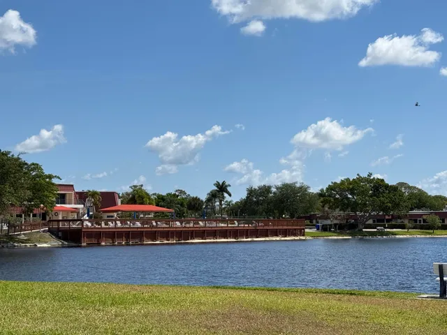 a living room with furniture a flat screen tv and a fountain