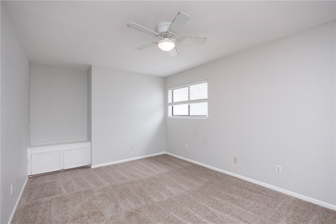 320 Long Point Drive Portland, TX 78374 - Photo 16 of 40 Neutral-toned room featuring light gray walls, car