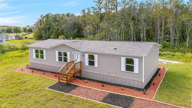 a view of a yard in front of a house with a yard