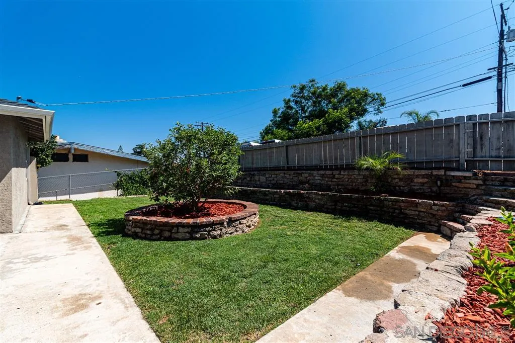 8648 Almond Road Lakeside, CA 92040 - Photo 3 of 15 a view of a backyard with plants and a tree