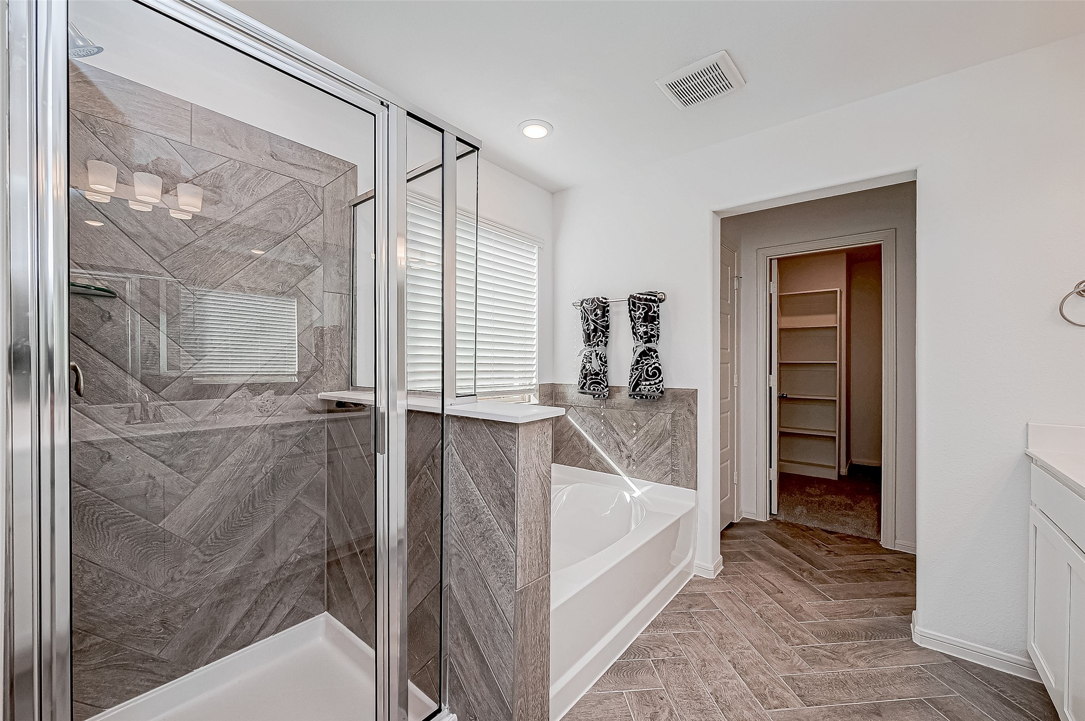 15941 Cy Young Court Splendora, TX 77372 - Photo 25 of 37 a bathroom with a bathtub and a shower