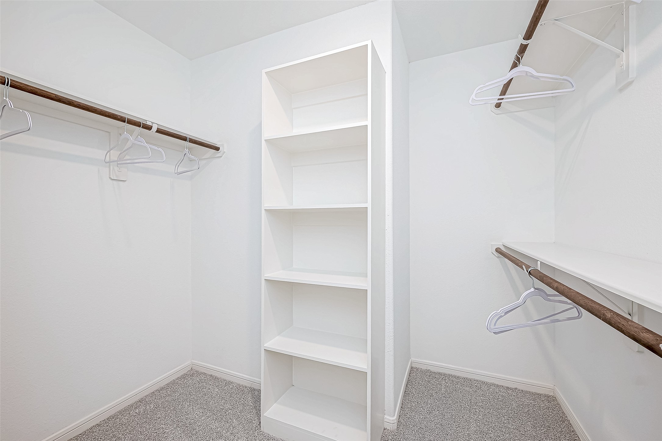 15941 Cy Young Court Splendora, TX 77372 - Photo 28 of 37 a view of walk in closet with empty racks
