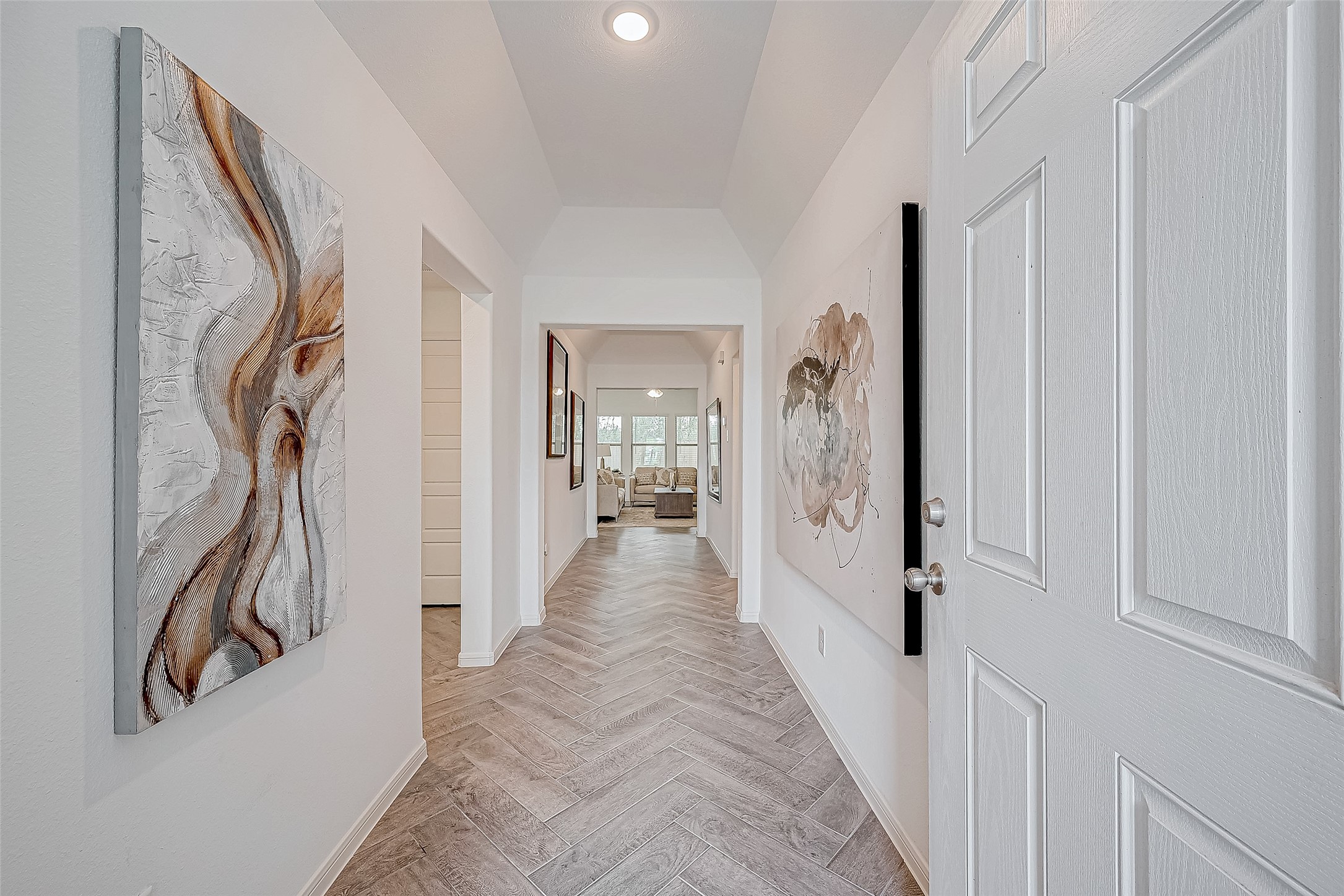 15941 Cy Young Court Splendora, TX 77372 - Photo 6 of 37 a view of a hallway with wooden floor and stairs