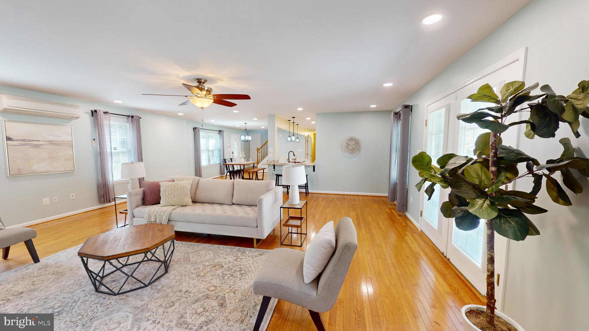 10600 Ward Road Dunkirk, MD 20754 - Photo 40 of 144 a living room with furniture a chandelier and a potted plant