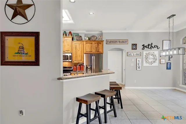 a view of kitchen with furniture and wooden floor
