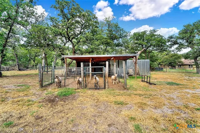 a house with trees in the background